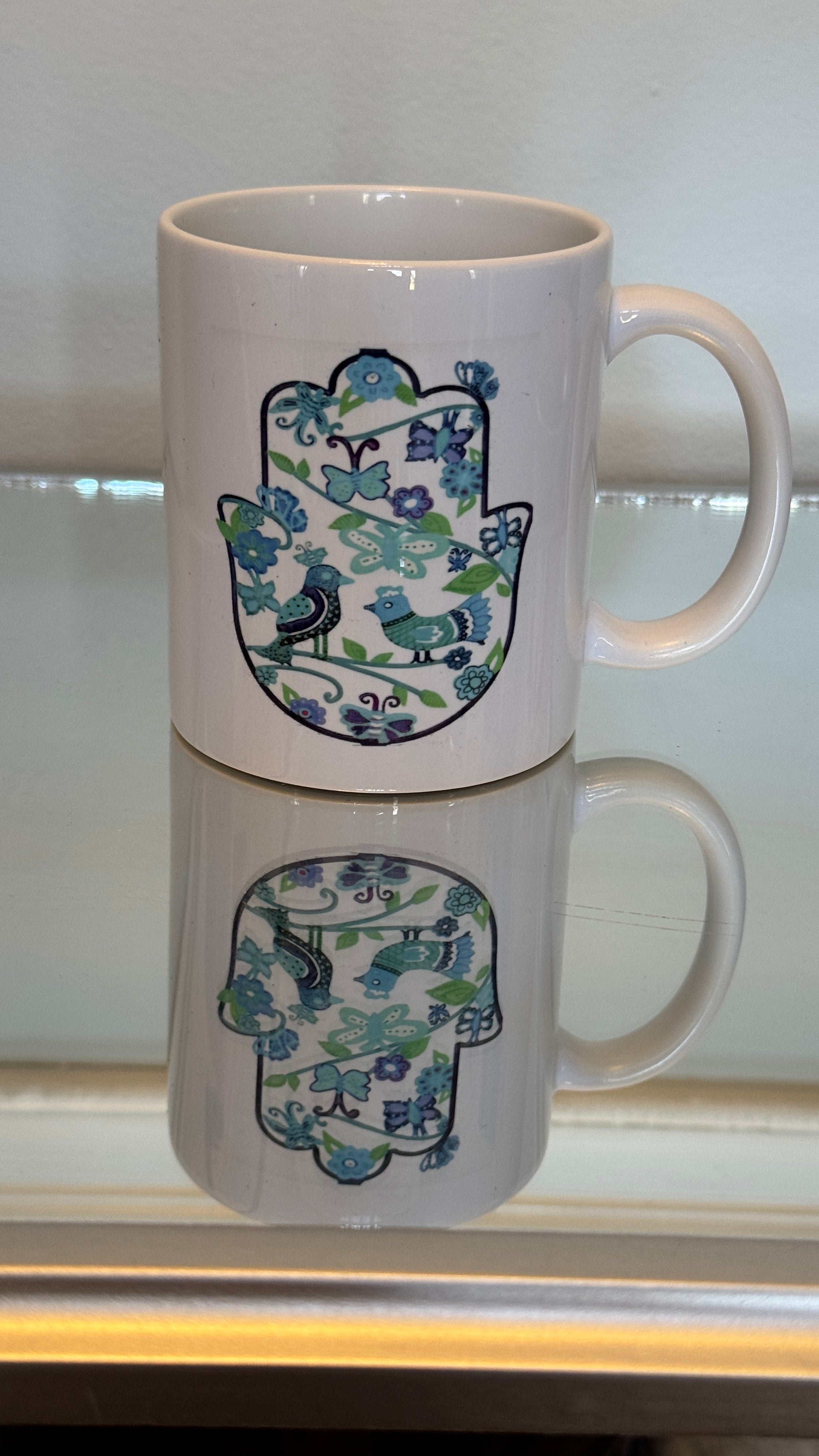 White Mug designed with colorful blue & teal color Fatimah's Hand