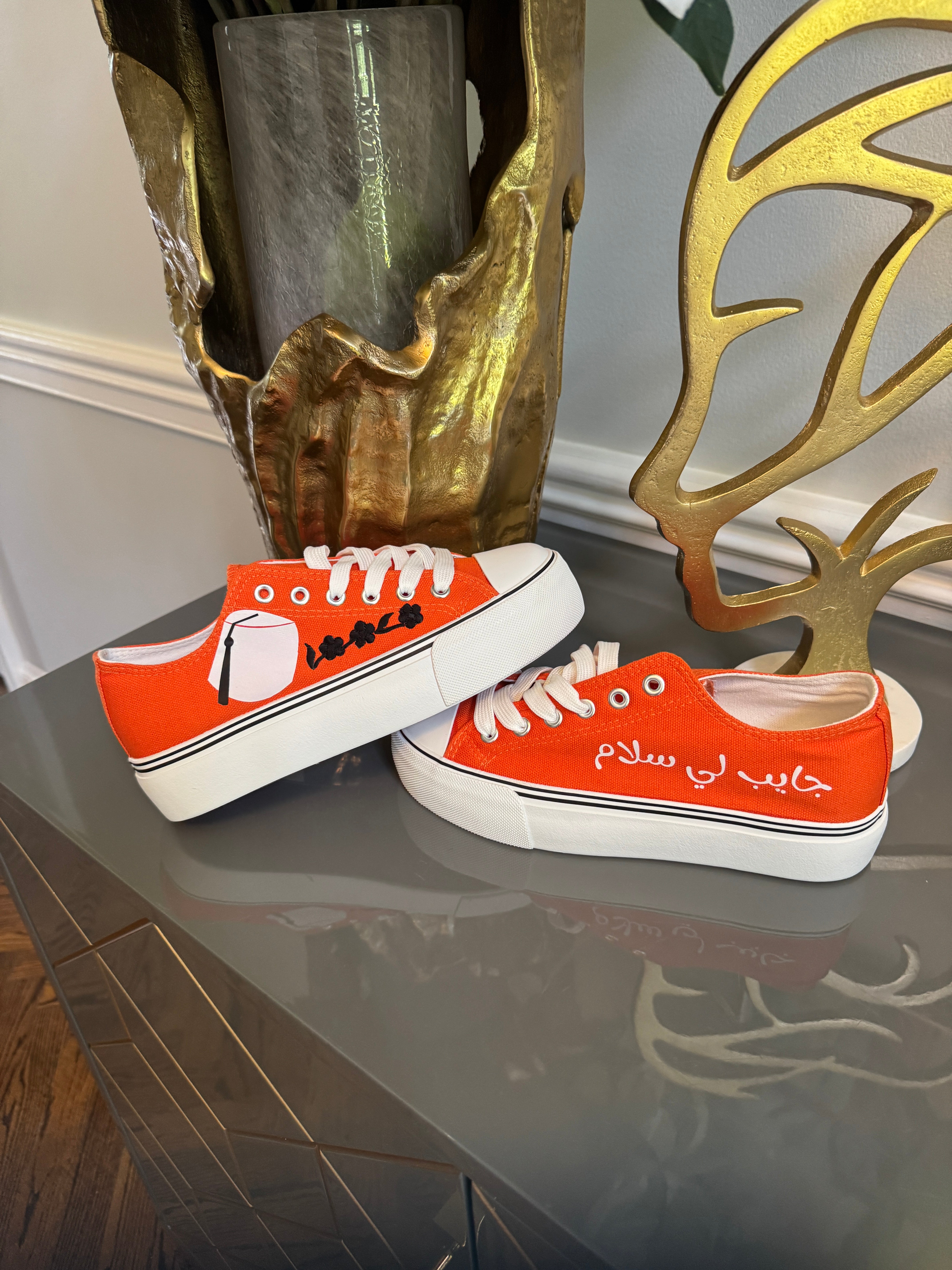 Orange Canvas Sneakers, designed with Arabic calligraphy جايب لي سلام and flower motifs