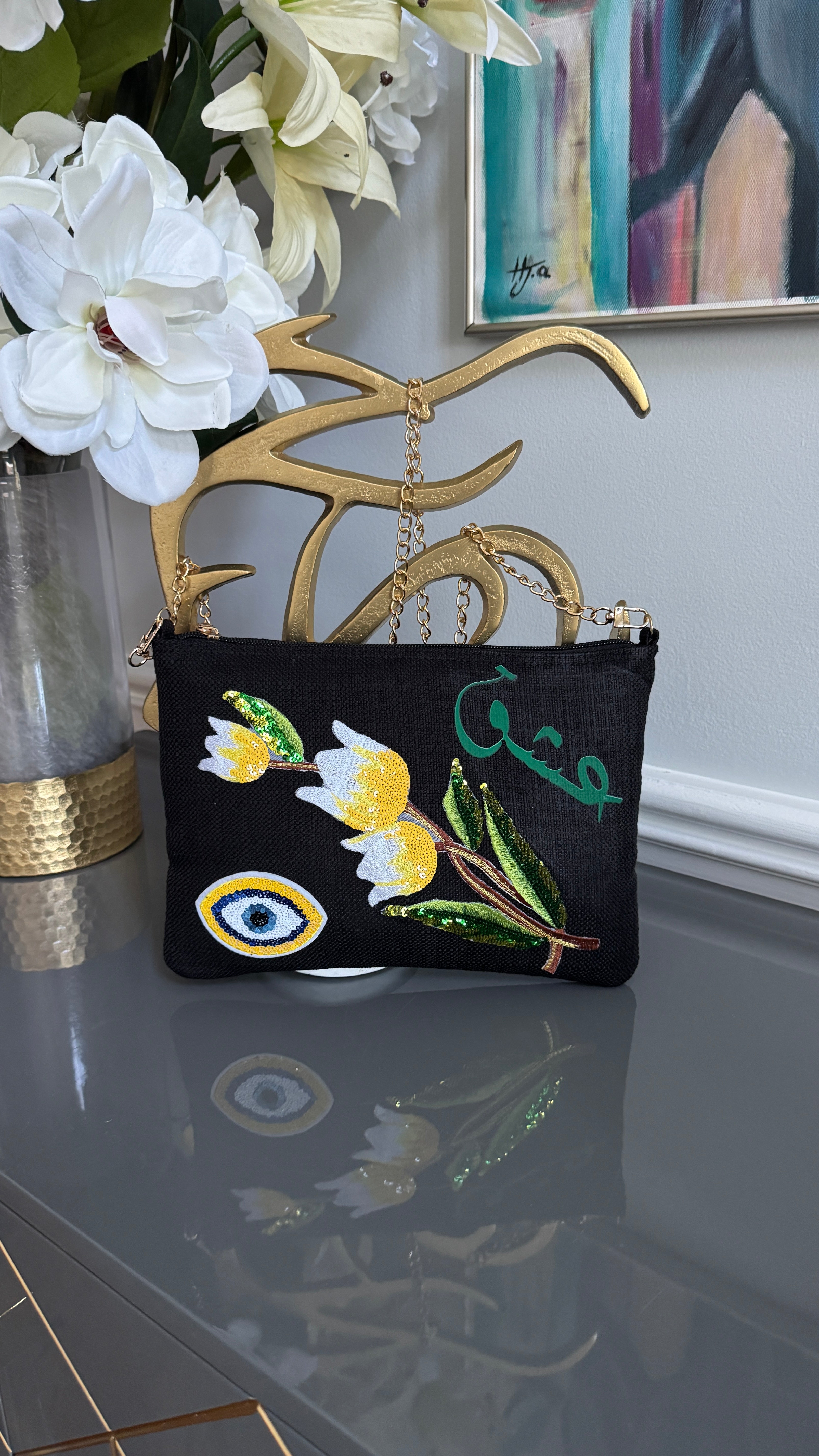 Black clutch with sequins flowers & Yellow Arabic Caligraphy عشق and evil eye design