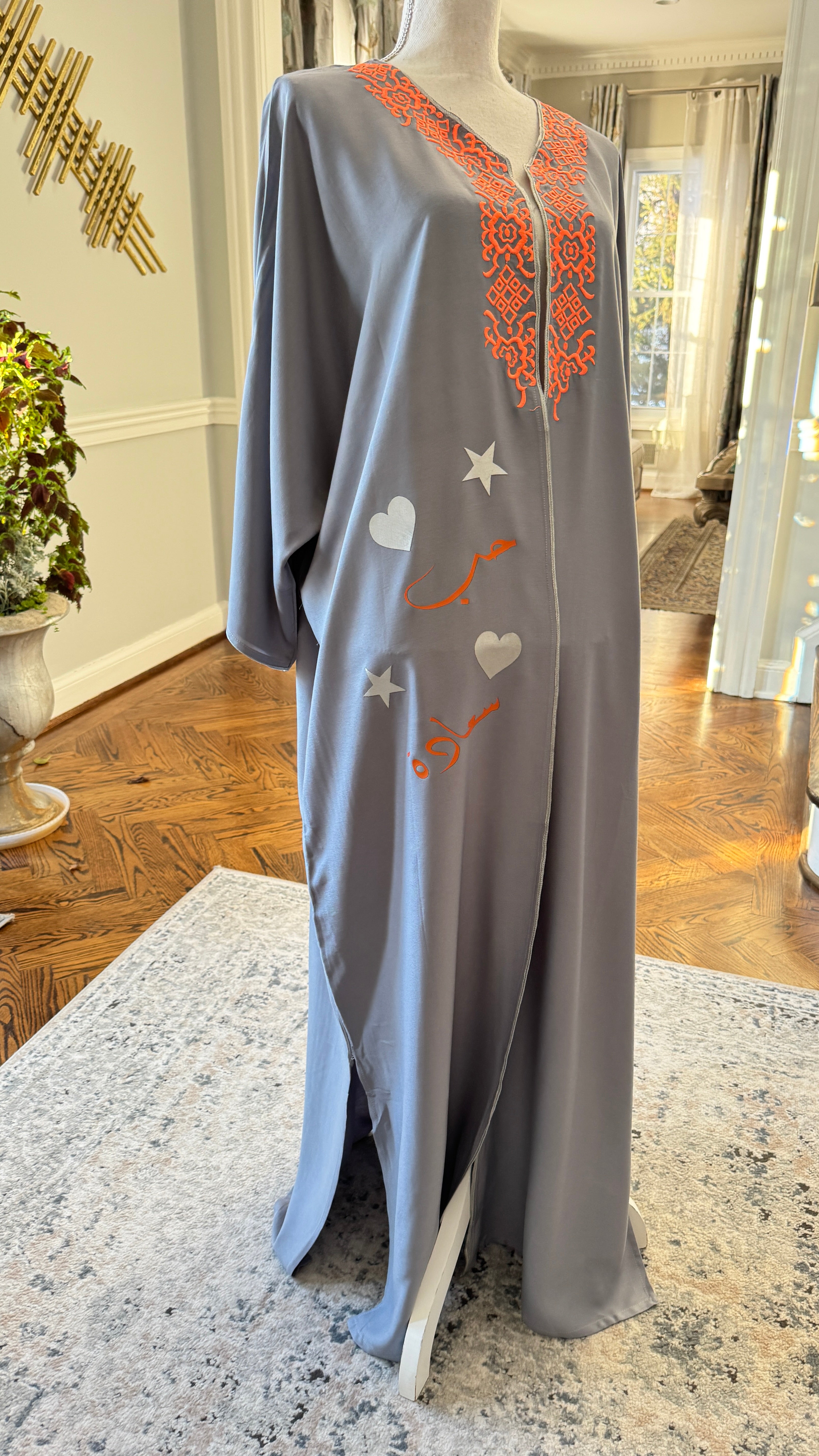 Gray Open caftan embroidery design on the front. Designed with Arabic Calligraphy حب، سعادة . Unique design on the back.