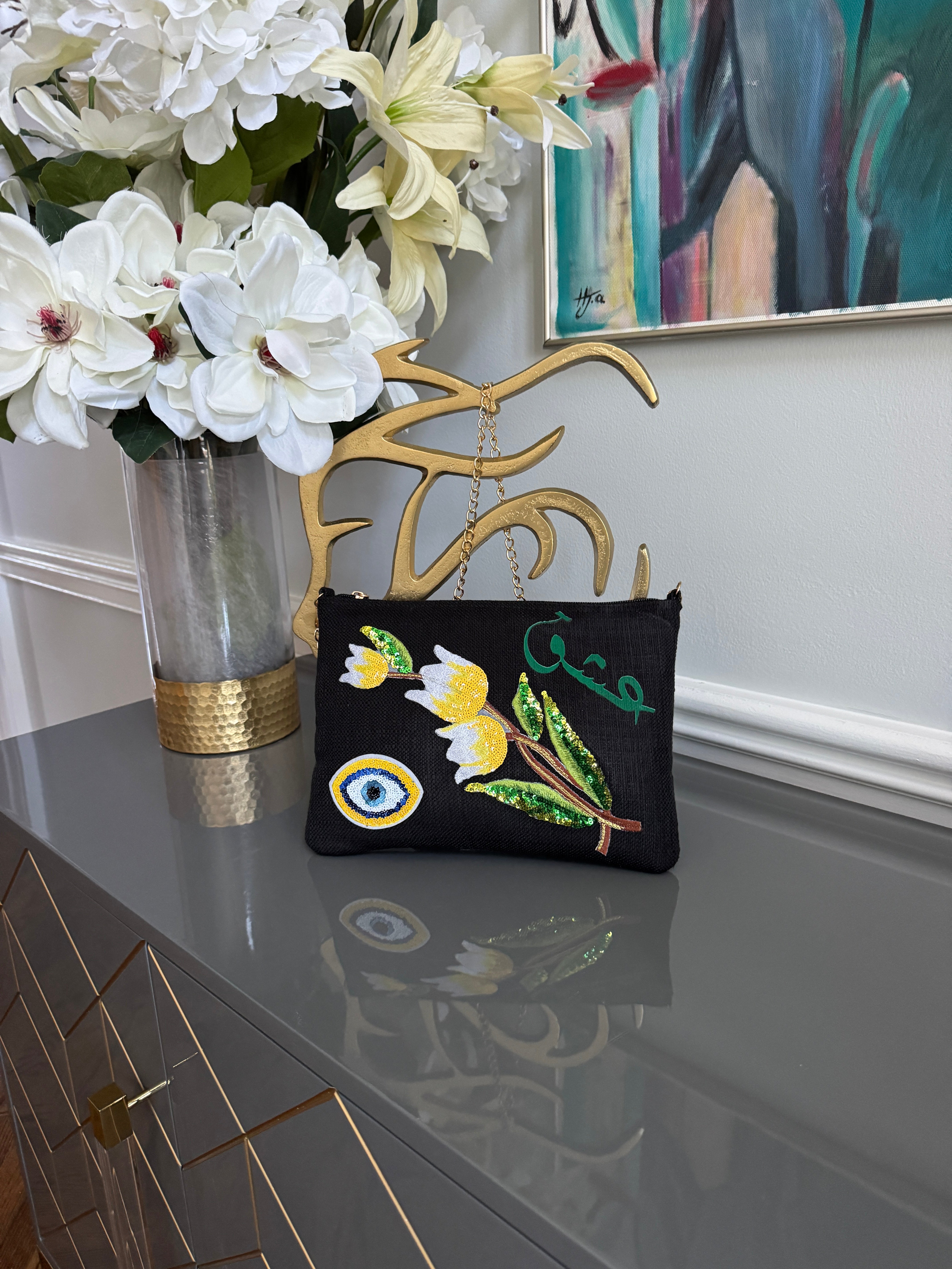 Black clutch with sequins flowers & Yellow Arabic Caligraphy عشق and evil eye design