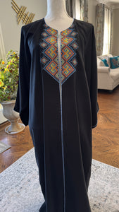 Black Open caftan embroidery design on the front. Designed with fun Arabic Calligraphy Unique design on the back. عليك عين، عندك سفرة، شايفي عريس