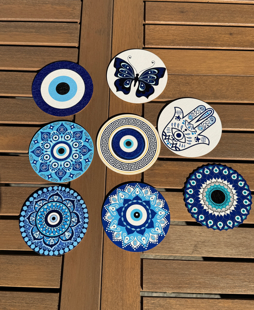 Set of eight wooden coasters hand painted Blue color evil eye theme