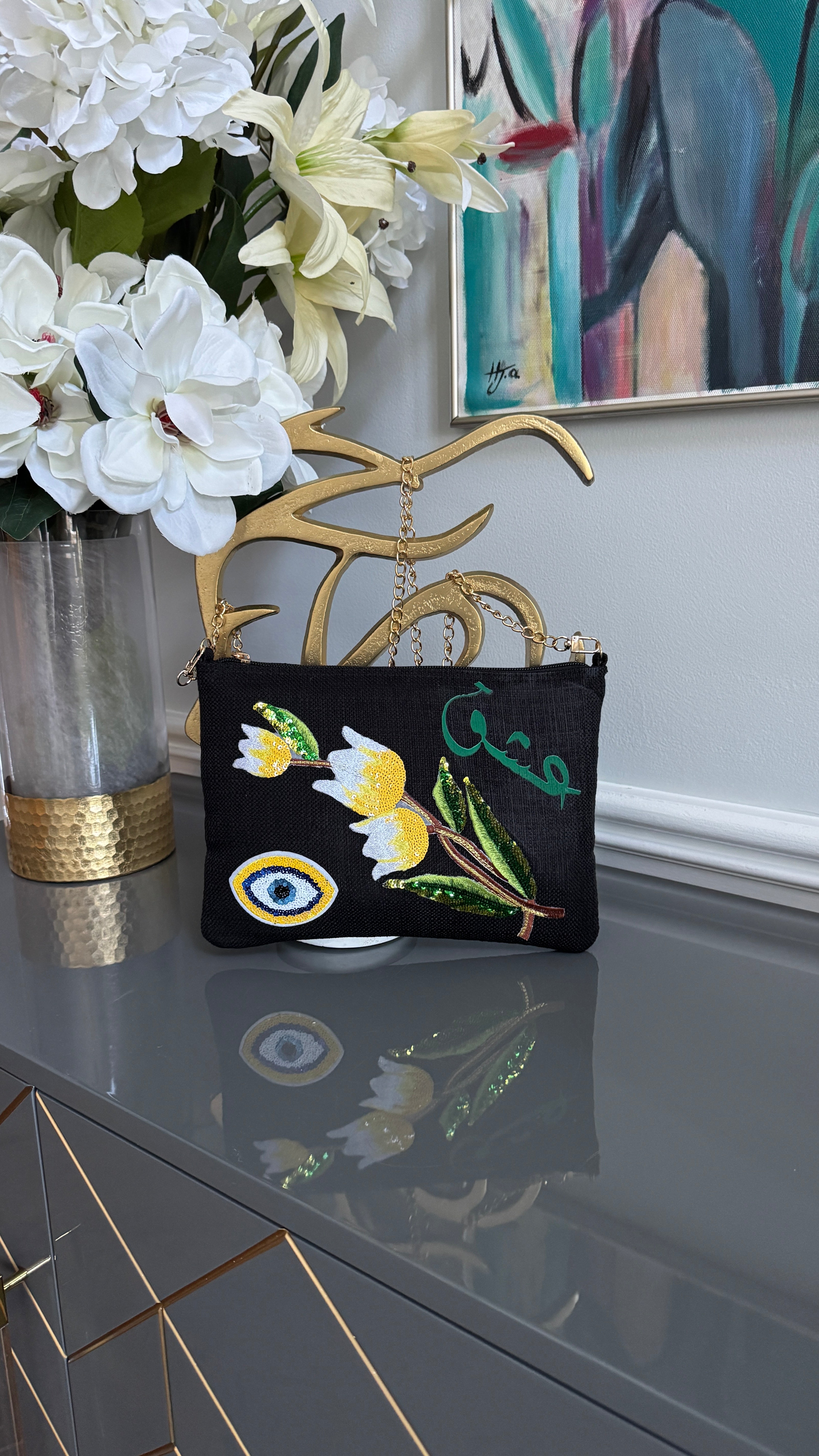 Black clutch with sequins flowers & Yellow Arabic Caligraphy عشق and evil eye design