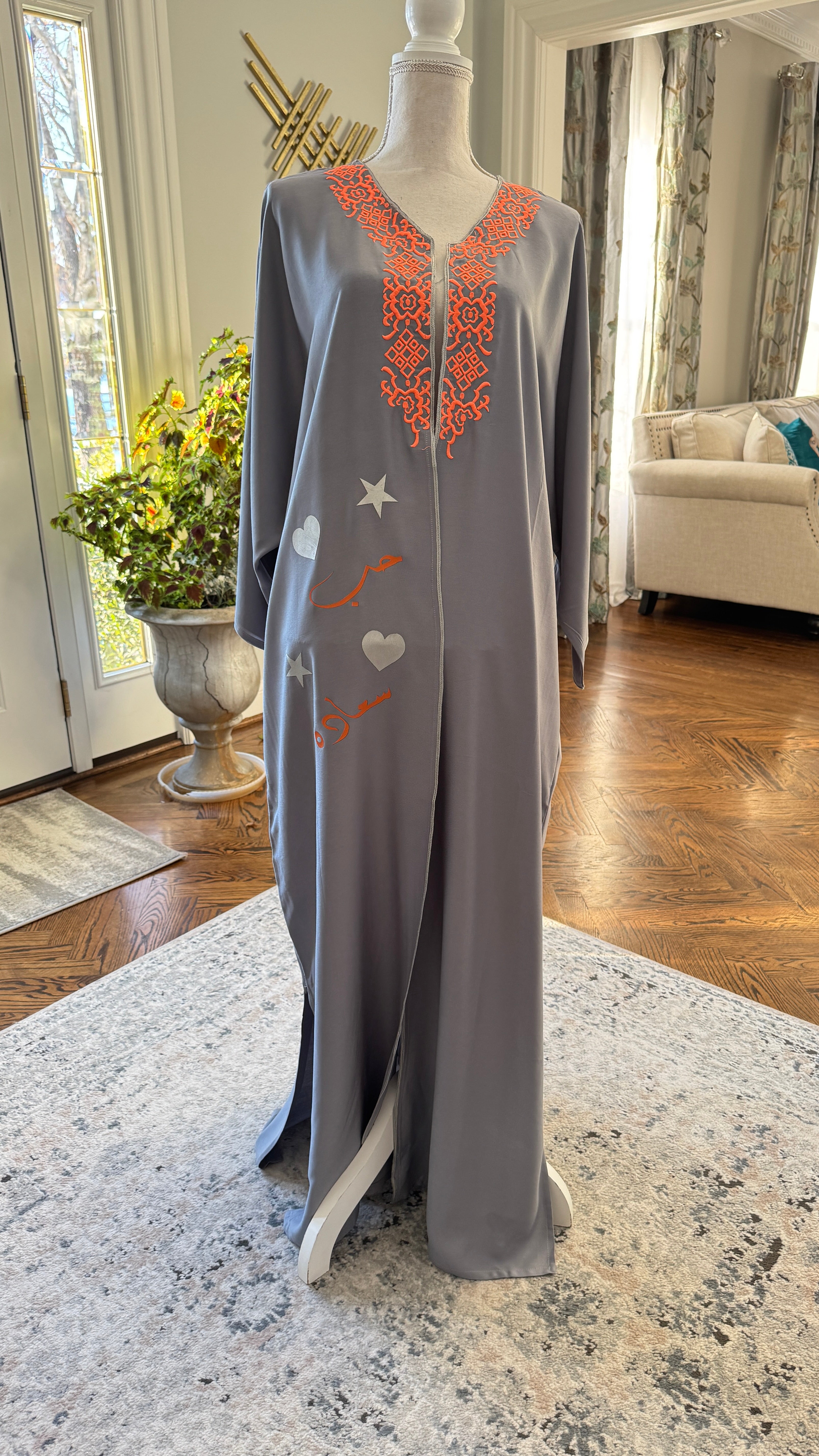 Gray Open caftan embroidery design on the front. Designed with Arabic Calligraphy حب، سعادة . Unique design on the back.