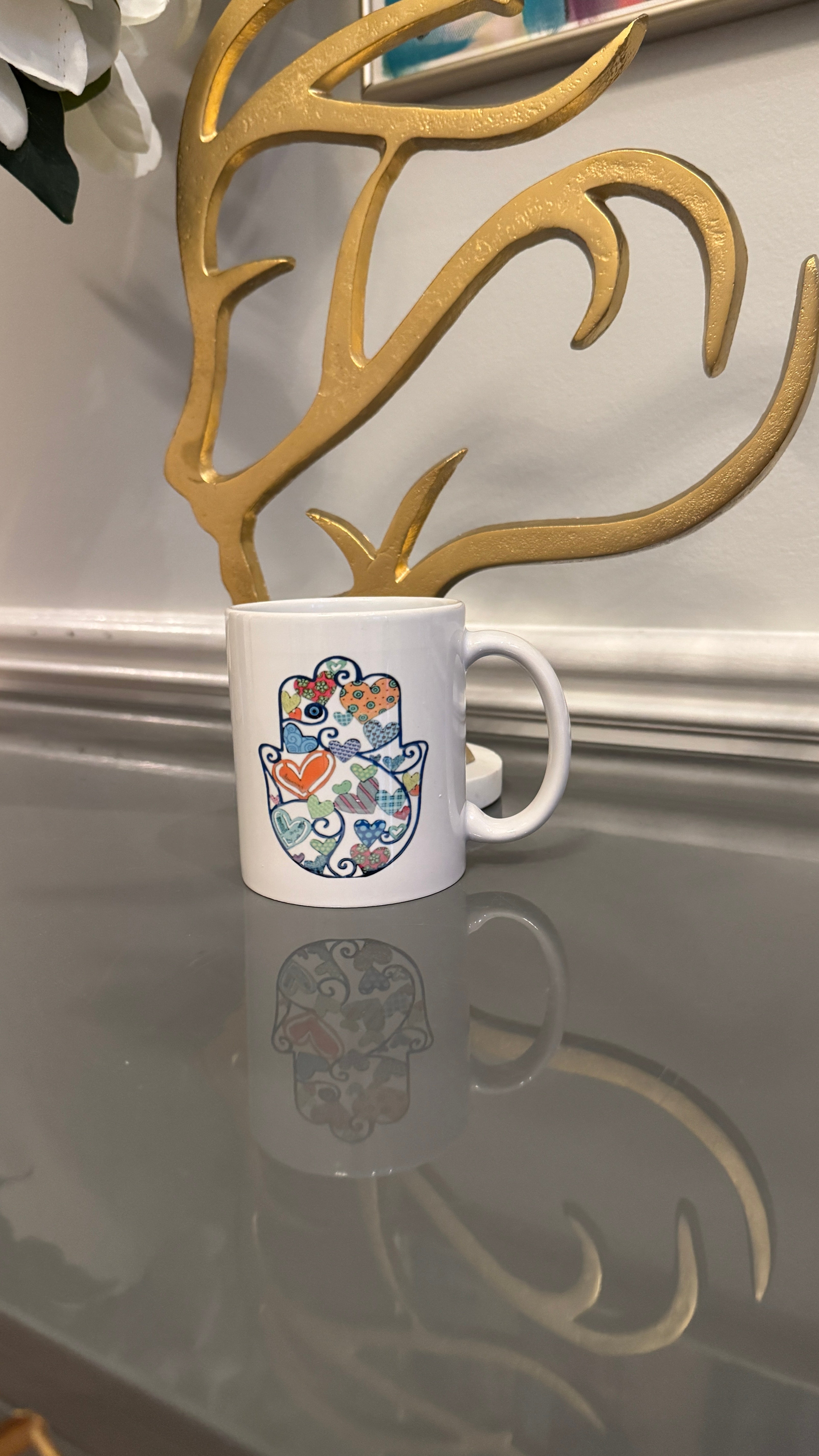 White Mug designed with colorful Fatimah's Hand