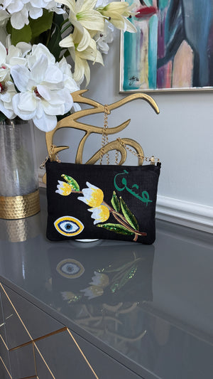 Black clutch with sequins flowers & Yellow Arabic Caligraphy عشق and evil eye design