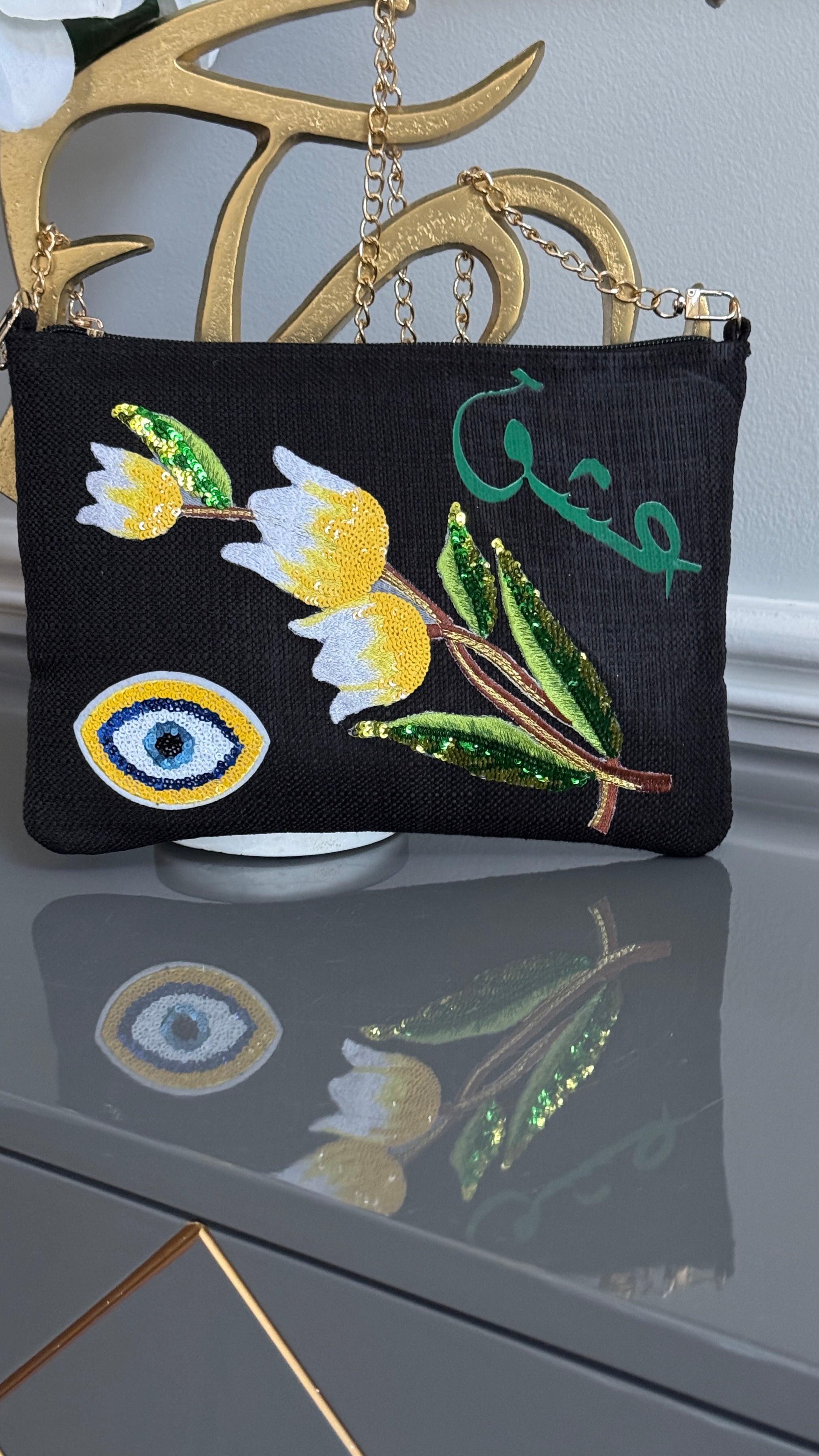 Black clutch with sequins flowers & Yellow Arabic Caligraphy عشق and evil eye design