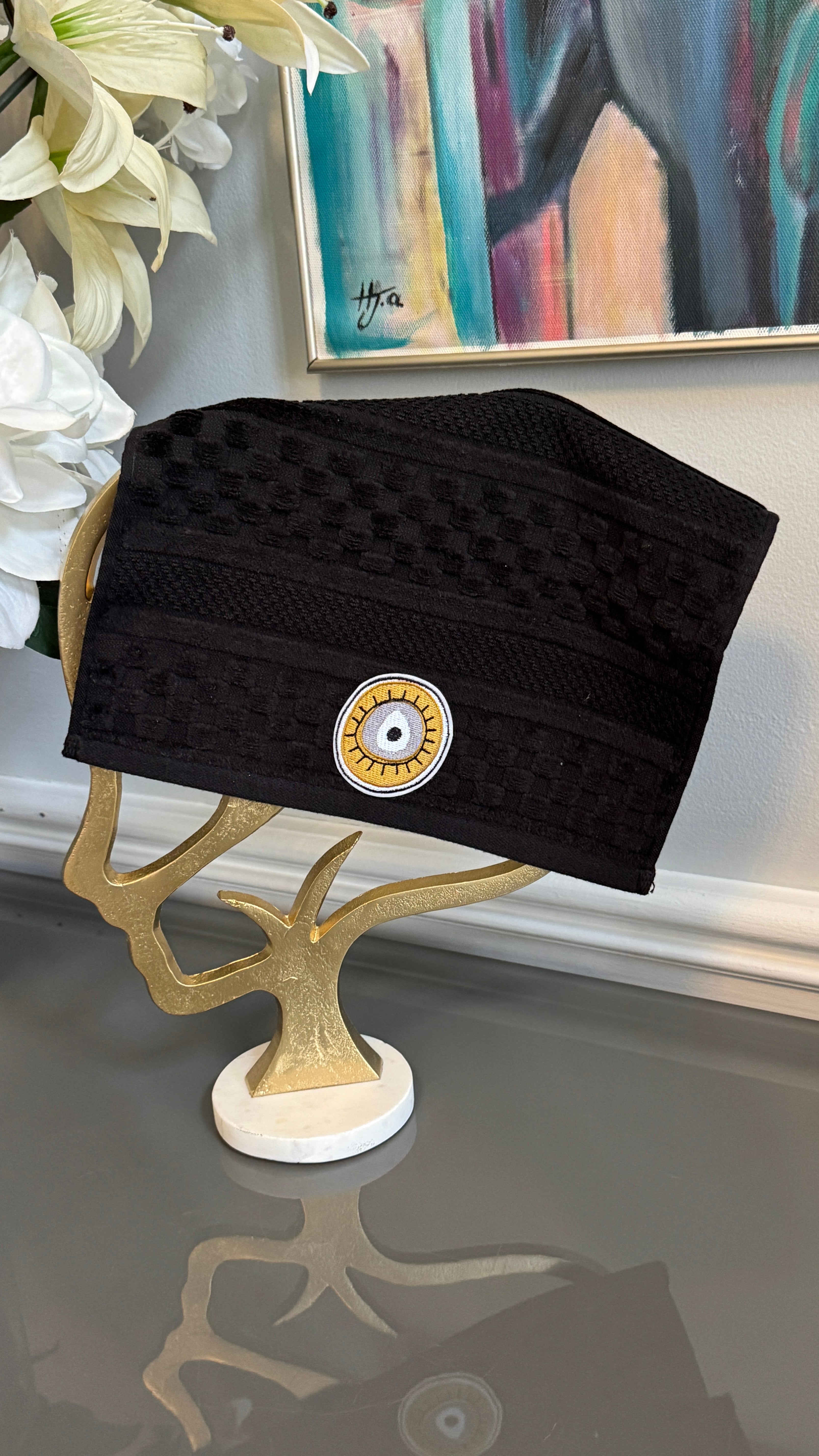 Black Hand towel designed with embroidery evil eye