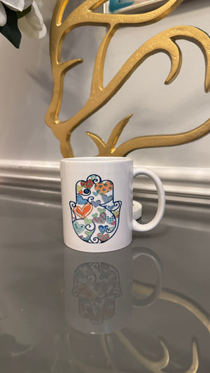 White Mug designed with colorful Fatimah's Hand