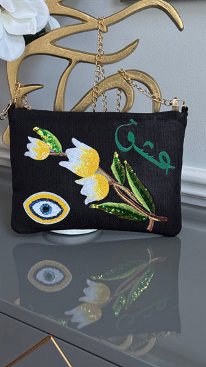 Black clutch with sequins flowers & Yellow Arabic Caligraphy عشق and evil eye design