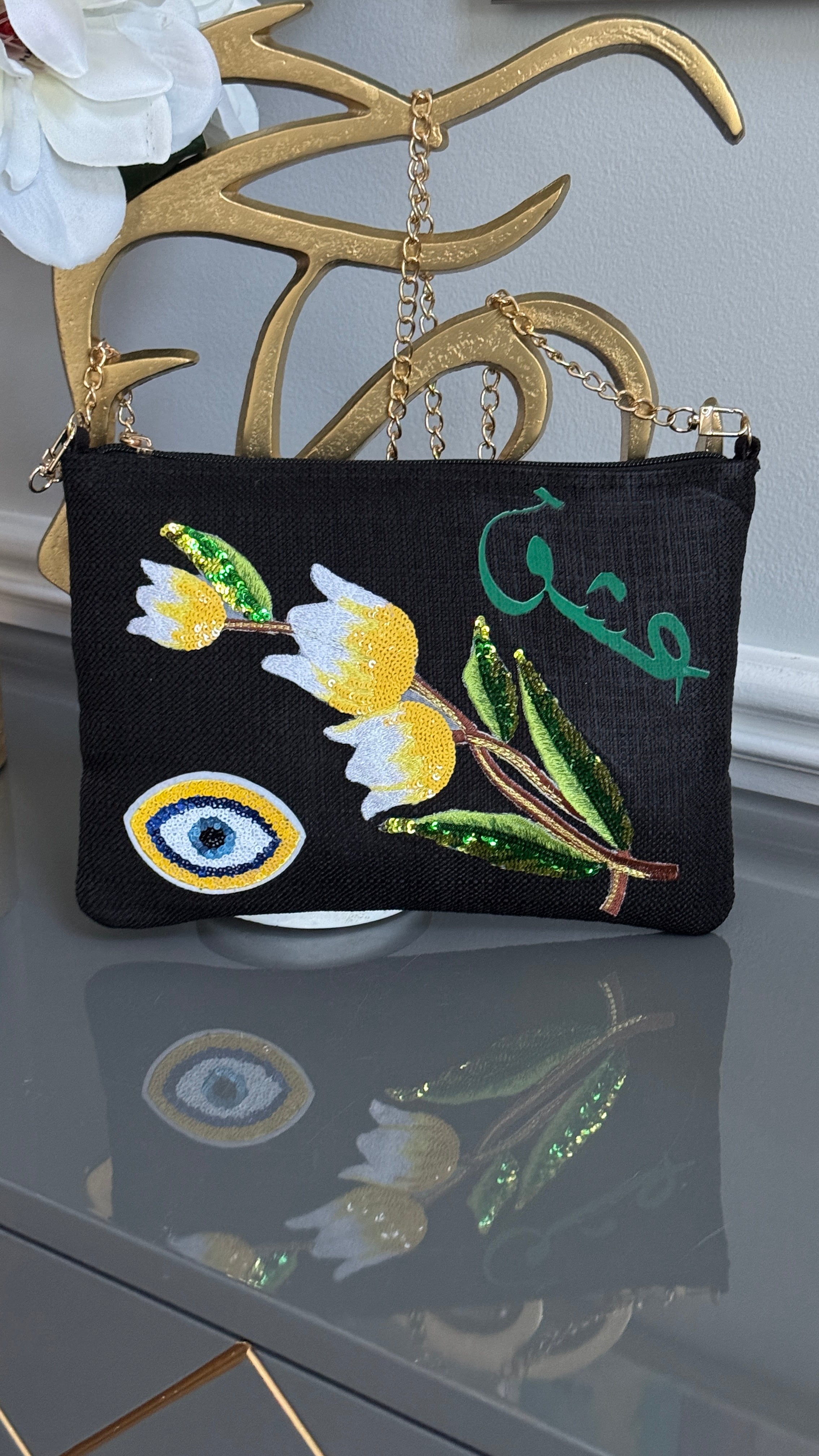 Black clutch with sequins flowers & Yellow Arabic Caligraphy عشق and evil eye design