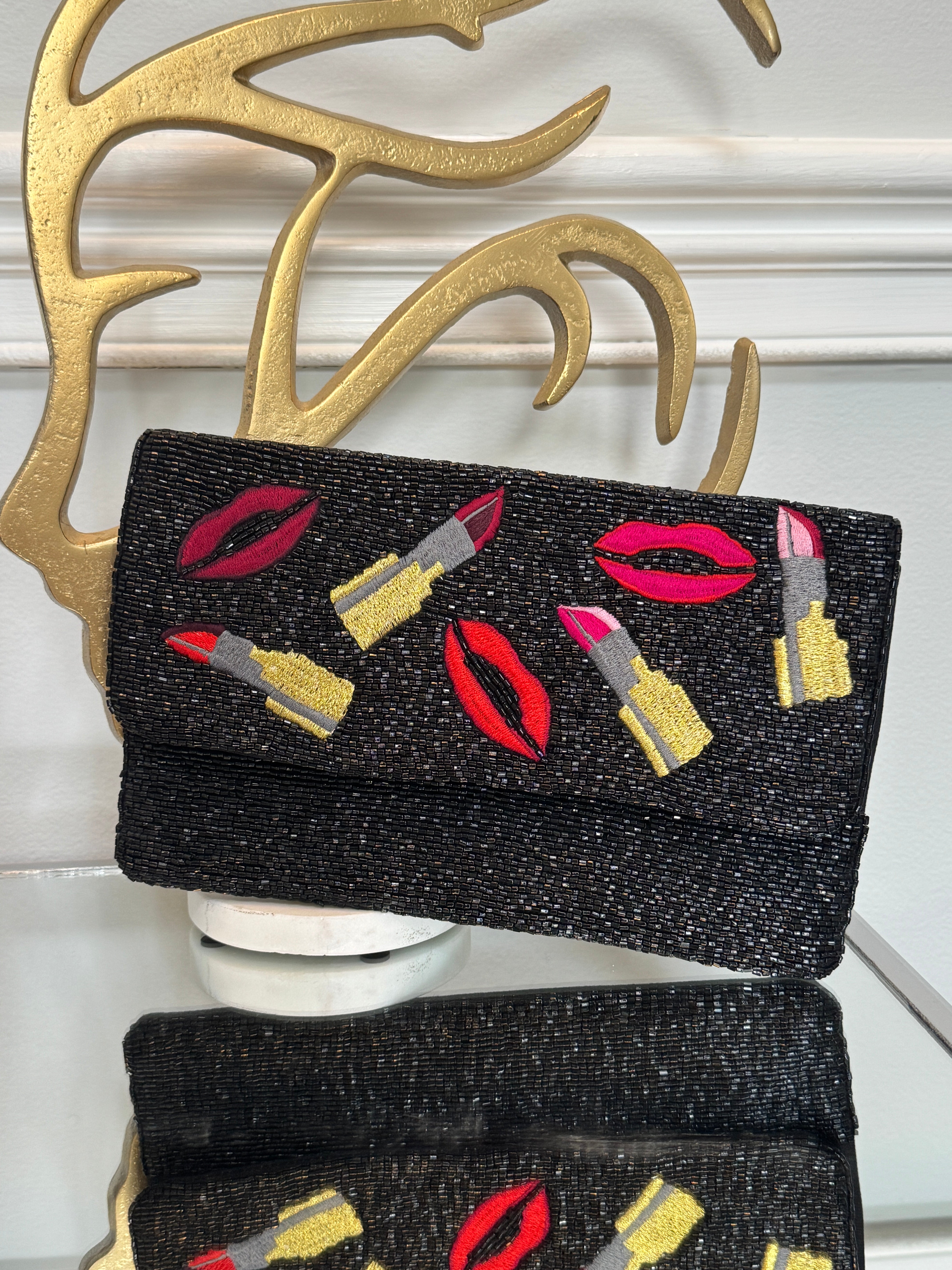 Black beaded & colored embroidery design clutch.