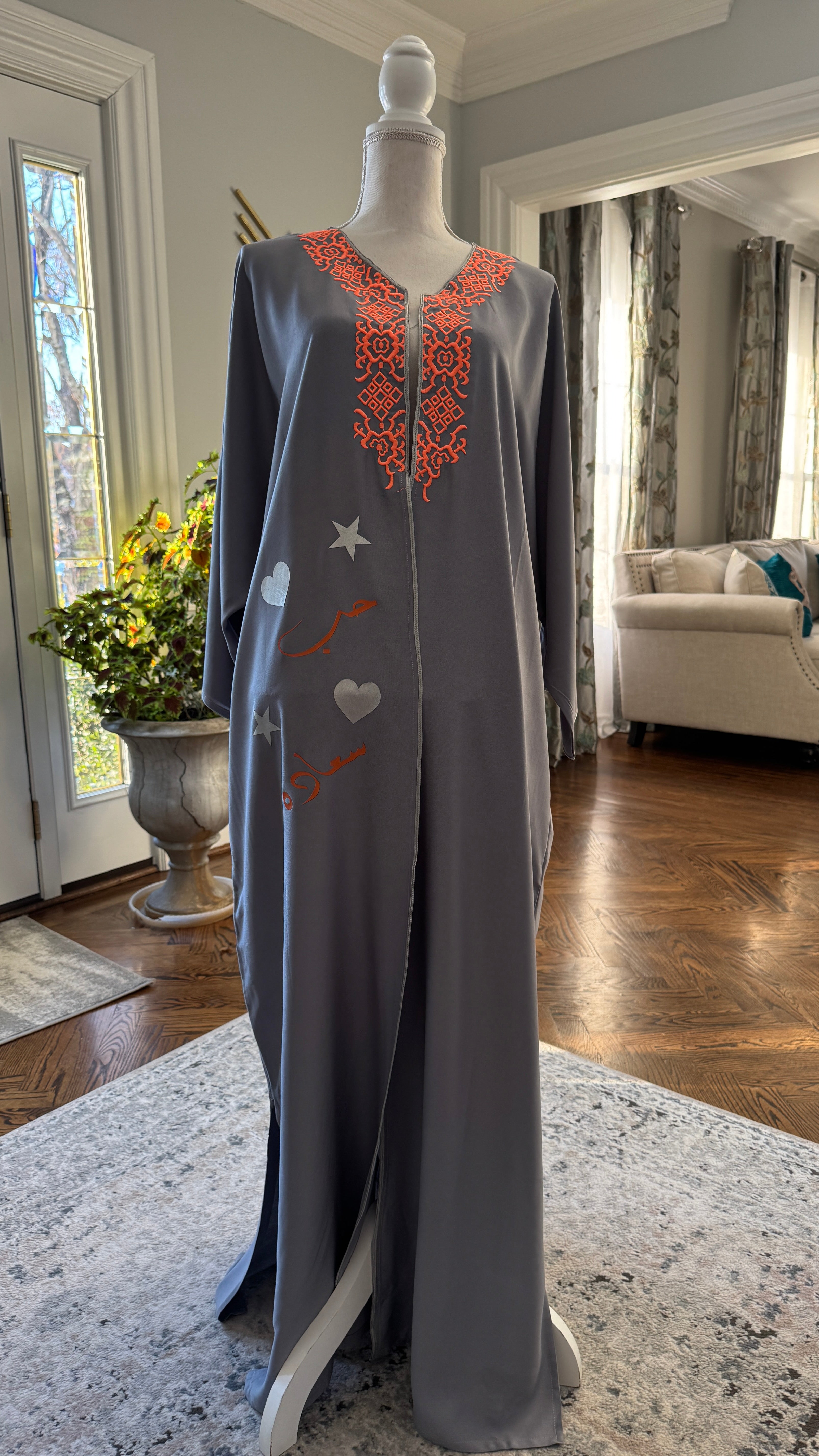 Gray Open caftan embroidery design on the front. Designed with Arabic Calligraphy حب، سعادة . Unique design on the back.