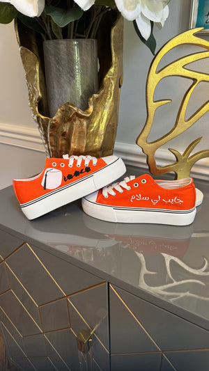 Orange Canvas Sneakers, designed with Arabic calligraphy جايب لي سلام and flower motifs