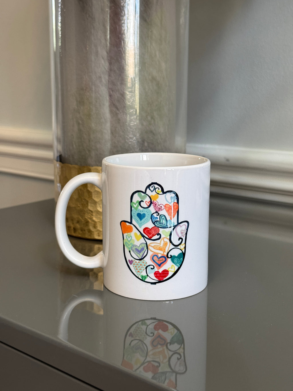 White Mug designed with colorful Fatimah's Hand