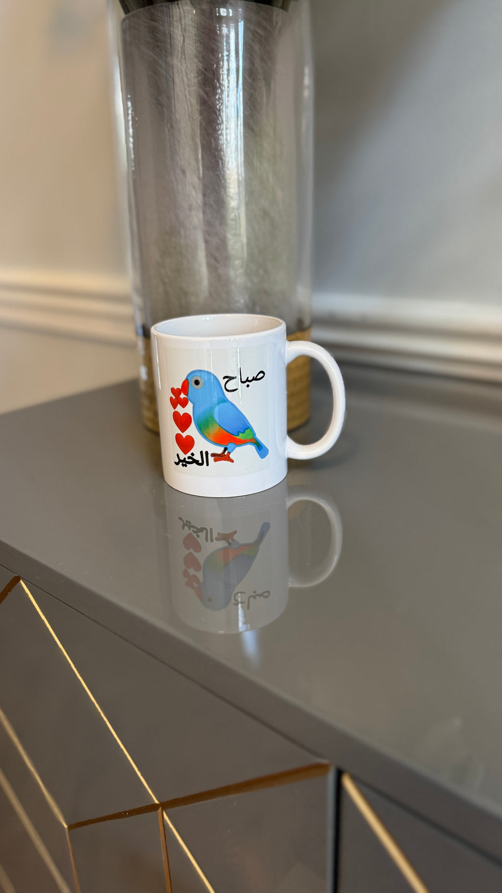 White Mug designed with vibrant colors bird and Arabic Calligraphy صباح الخير