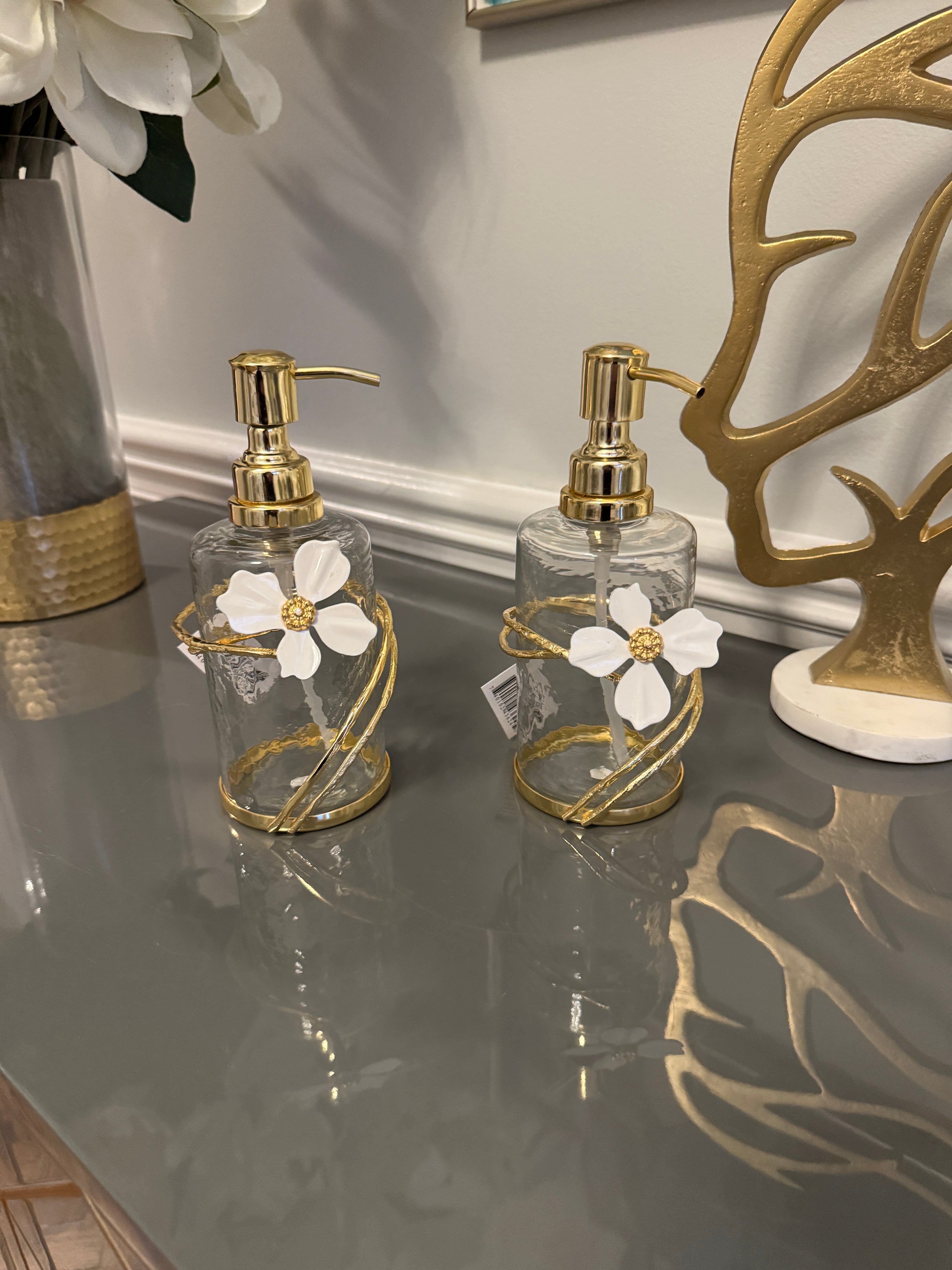 Soap and Lotion Dispenser with Gold Jewel Flower Design.