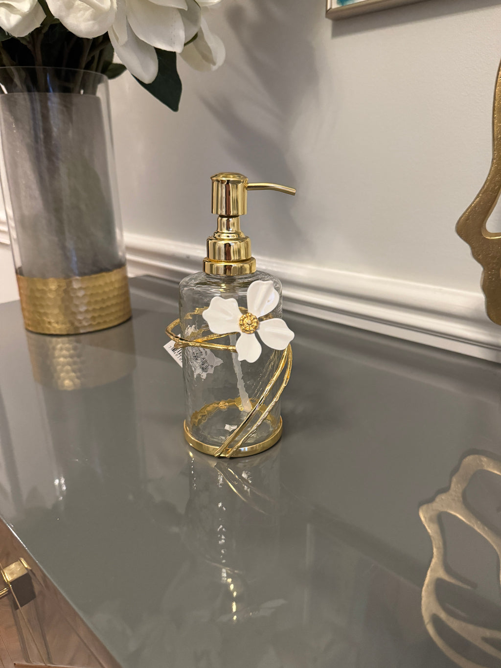 Soap and Lotion Dispenser with Gold Jewel Flower Design.