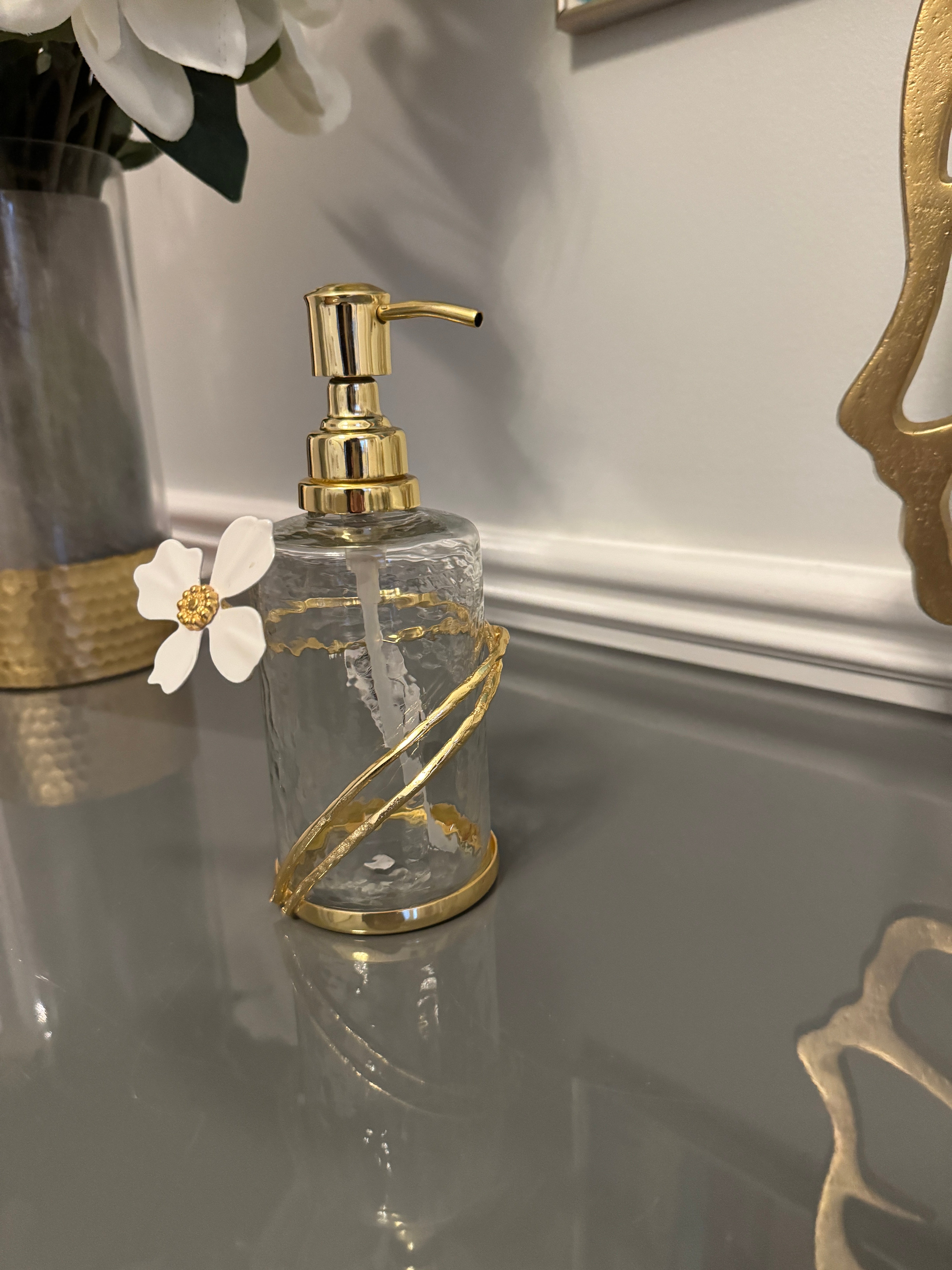 Soap and Lotion Dispenser with Gold Jewel Flower Design.