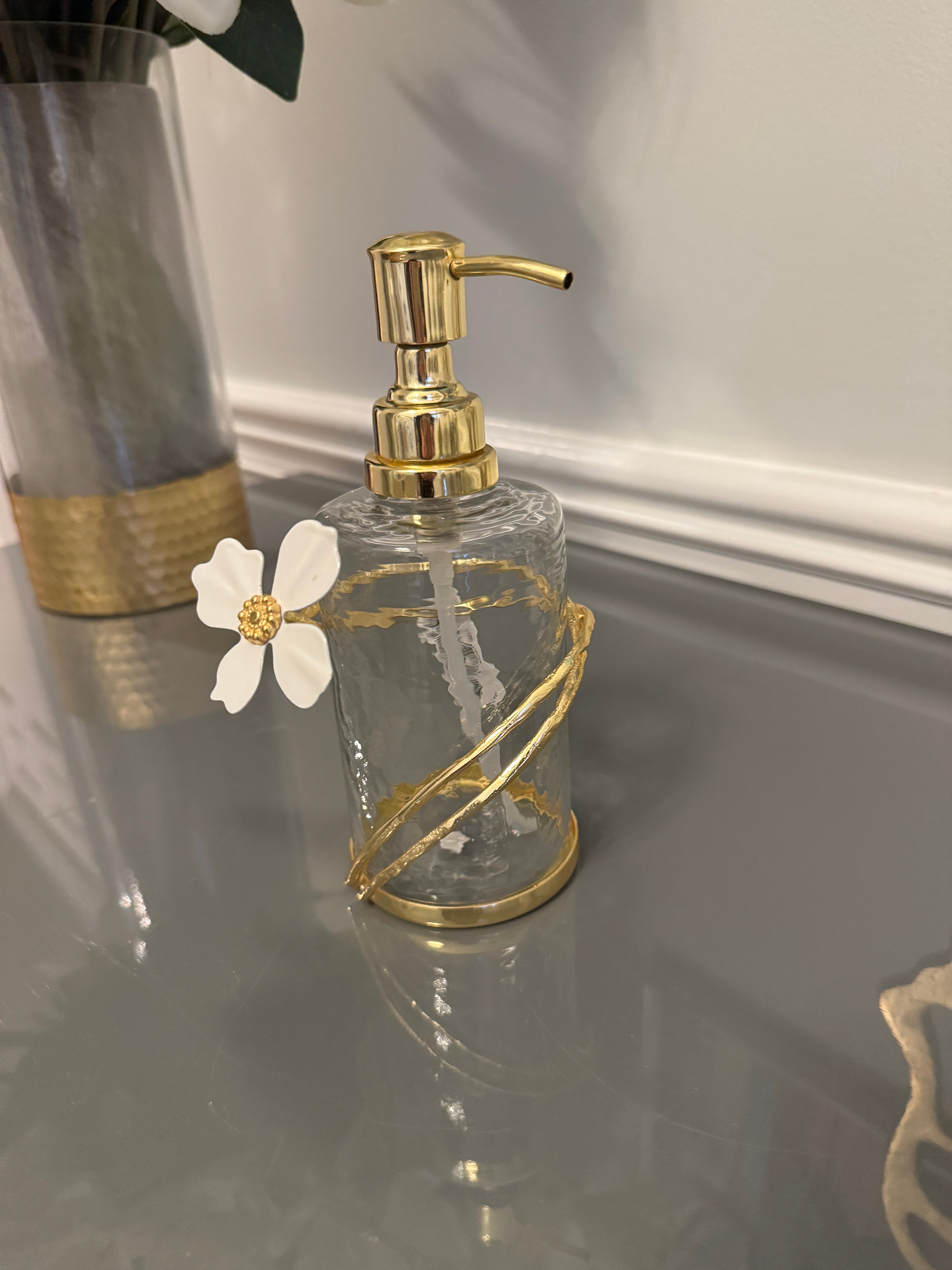 Soap and Lotion Dispenser with Gold Jewel Flower Design.