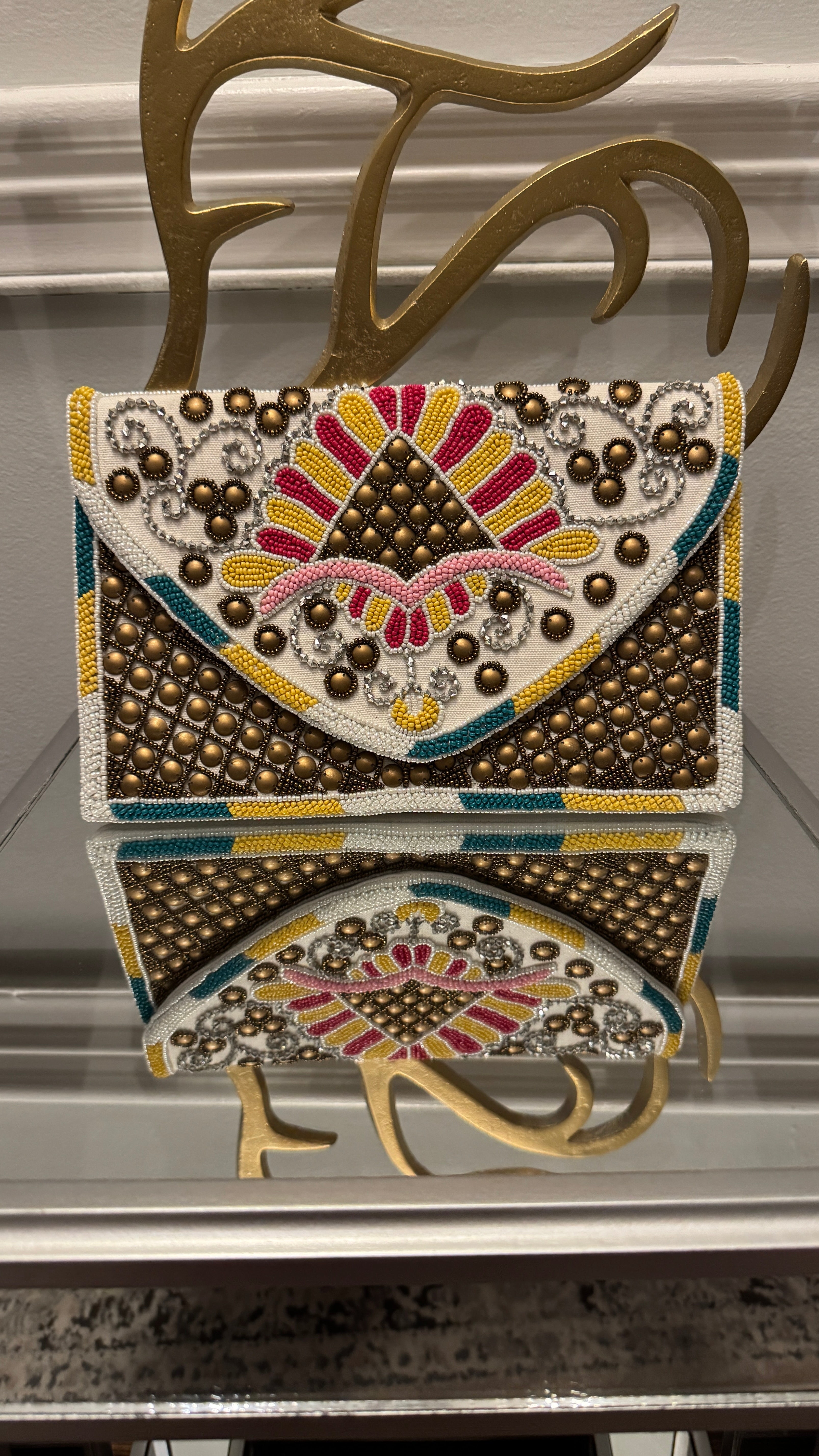 Hand beaded multi-colored with bronze studs clutch