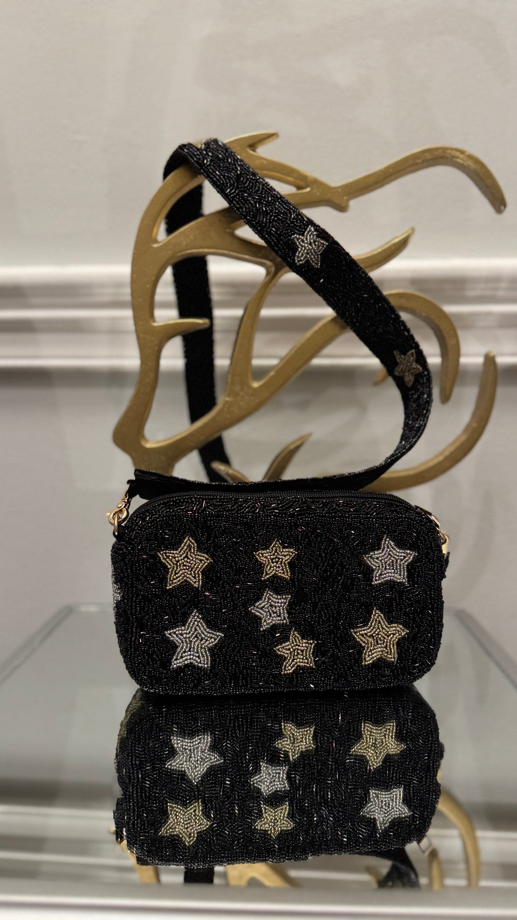 Black beaded crossbody bag with beaded straps.