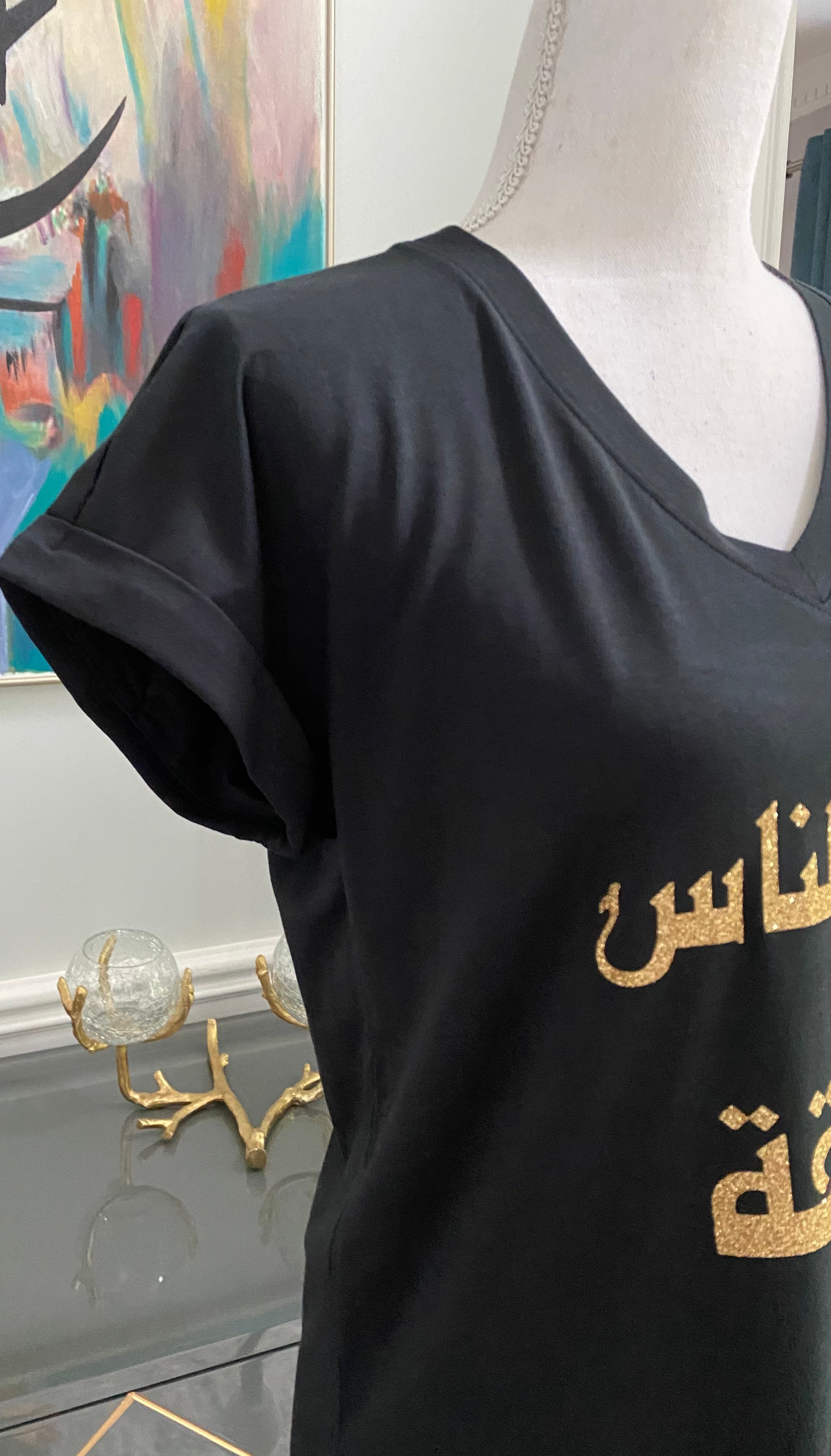 Black v-neck top with Arabic calligraphy Design